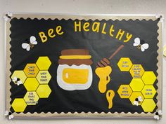 a bulletin board with bees and honey on it