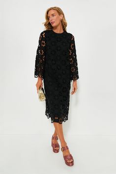 This best-selling silhouette is back in an updated look! The Noir Eyelet Hutton Dress is an elegant style perfect for date nights, dinner parties, and beyond. Featuring unlined floral lace bell sleeves, side slits for ease of movement, and an easy straight silhouette, this look can be styled hundreds of ways. Pair with heels and a clutch or ballet flats and a top-handle bag! Crewneck Long bell sleeves with scalloped edge Back zip closure Straight silhouette Side slits Midi length Lined body, unl Elegant Midi Dress With Cutwork Hem, Fall Evening Dress With Scalloped Lace, Elegant Midi-length Lace Dress With Cutwork Hem, Scalloped Lace Evening Dress For Fall, Spring Evening Dress With Cutwork Hem, Chic Midi Dress With Cutwork Hem, Spring Midi Dress With Scalloped Lace For Date Night, Chic Knee-length Midi Dress With Cutwork Hem, Elegant Lace Midi Dress For Brunch