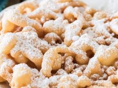 powdered sugar cookies are on a plate and ready to be eaten for breakfast or dessert