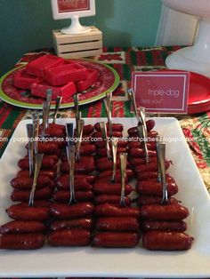 there are many hotdogs on the table ready to be eaten and served for guests