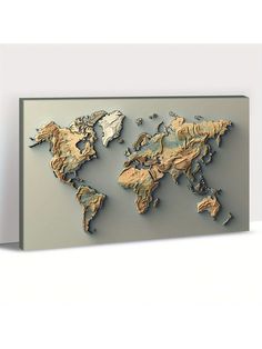 a metal world map mounted on a wall