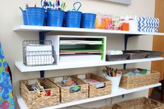 the shelves are organized with baskets, books and stationery items for children to use