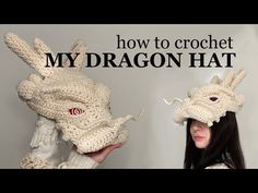 a woman holding up two crocheted hats with the words how to crochet my dragon hat