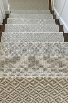 carpeted stairs leading up to a door