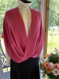 This Wrap is a must for any wardrobe. Can be worn casual for on an elegant evening out. Woven in acrylic and acrylic boucle yarns. Elegant Party Knitted Sweater, Elegant Pink Knitted Sweater, Elegant One-size Knit Sweater, Elegant One-size Spring Sweater, Elegant One Size Sweater For Spring, Elegant Fitted Hand-knitted Sweater, Elegant Hand Knitted Fitted Sweater, Elegant Fitted Hand Knitted Sweater, Boucle Yarn