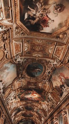 an ornate ceiling with paintings on it