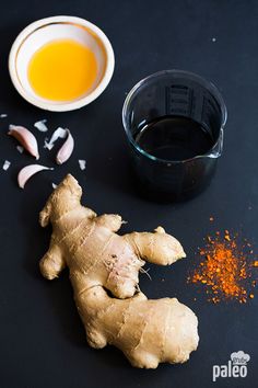 ginger root, tumerical and spices on black surface