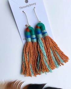 "Textile Earrings Made of Cotton  Indigo + Madder Root  Plant Dyed Overall Length - 3.5\" Width -Top - .5\" Bottom Tassel- 2\" Hypoallergenic gold plated ear wire" Bohemian Woven Jewelry For Spring, Spring Bohemian Woven Jewelry, Bohemian Woven Earrings For Spring, Gold Bohemian Tassel Earrings For Spring, Green Bohemian Woven Earrings, Bohemian Green Woven Earrings, Bohemian Orange Earrings For Spring, Woven Dangle Earrings For Festival, Spring Handmade Adjustable Tassel Earrings