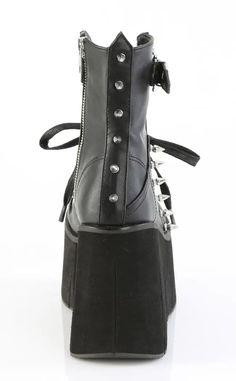 The Kera series features an impressive platform wedge across a range of styles to suit everyone who wants to tower over the competition. Vegan Black PU leather 4 1/2" Inch (114mm) Platform Lace-Up Front Ankle Boot Featuring Top Skull Buckle Strap & Metal Spike Stud Details Inner Side Metal Zip Closure U.S women's sizing-refer to size chart for more info Emo Boots, Demonia Boots, Demonia Shoes, Metal Spikes, Black Platform Boots, Patent Heels, Black Vegan, Platform Ankle Boots, Black Platform