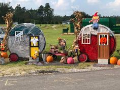 an outdoor display with pumpkins and decorations