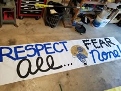 a sign that says respect for all moms and dads on the floor in a garage