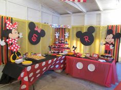 a mickey mouse themed birthday party with food and decorations