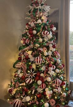 a decorated christmas tree with candy canes and ornaments