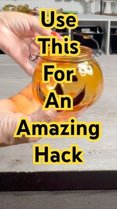 a hand holding a jar filled with liquid and the words use this for an amazing hack