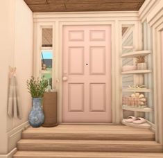 a pink door in a white room next to some shelves and a blue vase with flowers