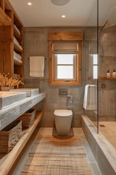 a bathroom with a toilet, sink and shower