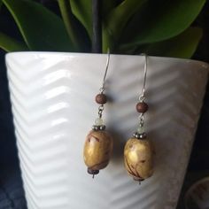 Tan Wooden Bead Earrings With Silver Hardware Hand Painted Floral Botanical Accent Wood, Silver And Agate Beadwork Lightweight, Not Heavy Vintage 90s, But Nwot, Never Worn, Excellent Condition Dangle Hook Style, Sterling Silver But Not Stamped - It Has That Look Of Aged Silver, You Can Tell. Approx 2.5&Quot; Long Handmade By Canadian Artisan Purchased At Annual Curated Art Market For Artists And Makers Bead, Simple, Classic, Timeless, Twee, Gypsy, Boho, Hippy, Hippie, Bohemian, Curated Natural, Wooden Bead Earrings, Hippie Bohemian, Bead Earrings, Floral Botanical, Art Market, Silver Hardware, Wooden Beads, Floral Painting, Beaded Earrings