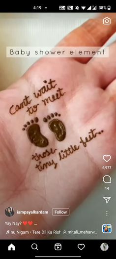 someone is holding their hand with the words baby shower element written on it in cursive writing