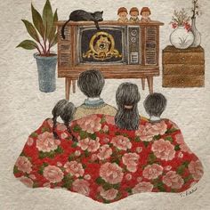 an image of three people sitting in front of a tv with flowers on the floor