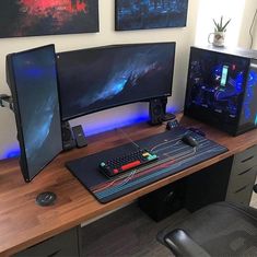 a computer desk topped with two monitors and a keyboard