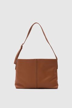 Elevate your style with this sophisticated faux leather shoulder bag. Designed for both elegance and functionality, this bag boasts a minimalist silhouette that complements any outfit. Material: Made from high-quality, smooth leather that provides a luxurious feel and long-lasting durability. Design: The bag features a clean, seamless design with subtle stitching along the edges, highlighting its refined craftsmanship. Its classic black color ensures versatility, making it an ideal accessory for Chic Bags With Smooth Grain Finish, Minimalist Satchel Shoulder Bag With Detachable Strap, Minimalist Shoulder Bag With Detachable Strap And Satchel Shape, Modern Crossbody Hobo Bag With Smooth Grain, Minimalist Hobo Bag With Adjustable Strap For Office, Minimalist Tote Shoulder Bag With Detachable Strap, Minimalist Leather Hobo Bag With Detachable Strap, Minimalist Everyday Bag With Detachable Strap, Chic Everyday Shoulder Bag With Smooth Grain