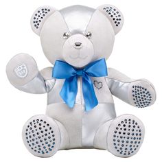 a white teddy bear with a blue bow