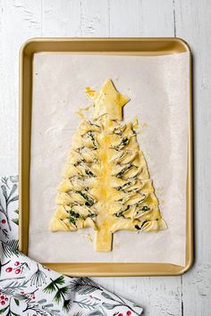 a christmas tree made out of pasta on a baking sheet