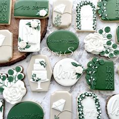 decorated cookies with green and white frosting on a table