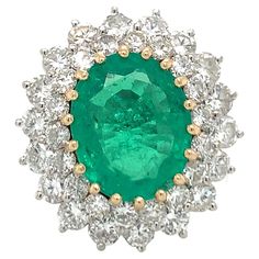 an oval emerald and diamond ring