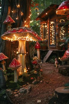 a group of mushrooms sitting on top of a forest floor next to a tree trunk