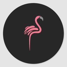 a pink flamingo bird on black round sticker