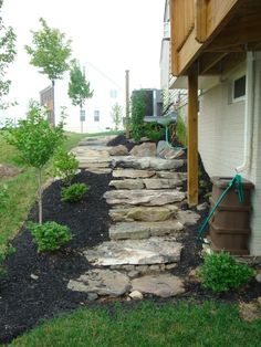 a stone path leading up to a house