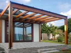 an outdoor covered patio with stone steps