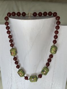 "For your consideration is a beautiful vintage Chinese carnelian and cloisonné beads in the shape of barrels necklace. It measures approximately 7.5\" long (about 15\" when open).The barrel beads measure approximately 1/2 of an inch (12 mm). The spring ring clasp is mark \"585\". All Florida residents will be charged a 6% state sales tax during the checkout process. Shipping Information- We know how important it is that your item arrive quickly and undamaged, so we will take great care in packin Traditional Jade Beaded Necklaces, Antique Beaded Necklace With Faceted Beads As Gift, Antique Beaded Necklace With Faceted Beads For Gift, Antique Beaded Necklaces With Faceted Beads As Gift, Vintage Faceted Beads Gems And Cabochons As A Gift, Vintage Beads For Festivals And Gifts, Vintage Gemstone Beads For Gifts, Vintage Faceted Beads For Gifts, Jade Beads With Large Beads For Gifts