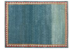 a blue rug with an orange border on the top and bottom part of it in two different colors