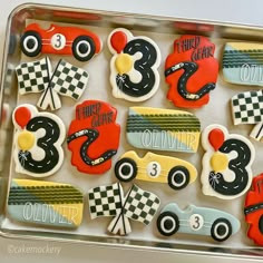 decorated cookies in the shape of race cars