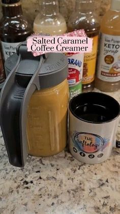 salted caramel coffee creamer next to a cup of coffee on a counter