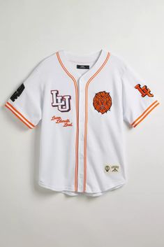 Lincoln University UO Exclusive Mesh Button-Down Jersey | Urban Outfitters Collegiate Baseball Jersey With Graphic Print, Varsity Jersey With Graphic Print For Fans, Casual White Baseball Jersey For Fan Gear, Casual White Baseball Jersey For Fans, White Graphic Print Baseball Jersey For Fans, Casual White Jersey For Fan Gear, Team-colored Baseball Jersey For Streetwear, Fan Apparel Jersey With Team Logo For Streetwear, Streetwear Fan Apparel Jersey With Team Logo