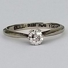 A beautiful old cut diamond, platinum & gold ring with tapered shoulders. The diamond is in excellent condition, extremely bright and very sparkly in natural daylight. Elegance and quality from the 1920's - 1940's, perfect for a special occasion. ▪ Overall Condition: Excellent ▪ Metal: Platinum & 18ct White Gold ▪ Gem: Diamond 40ct ▪ Gem Clarity: Si ▪ Gem Cut: Old Cut ▪ Gem Colour: H ▪ Ring Size UK: L ▪ Ring Size US: 5.85 ▪ Resizing: Quotation Available ▪ Marked: "Plat" & "18ct"  ▪ Weight: 2.0 g Diamond White Round Cut Diamond Ring For Marriage, Antique Brilliant Cut Diamond White Ring, Antique Brilliant Cut Diamond White Diamond Ring, Antique Diamond White Diamond Ring With Brilliant Cut, Antique Single Diamond White Diamond Ring, Antique Style Single Diamond Ring In Diamond White, Brilliant Cut Diamond Ring For Marriage, Brilliant Cut Diamond White Diamond Ring For Marriage, Timeless Brilliant Cut Diamond Ring For Marriage