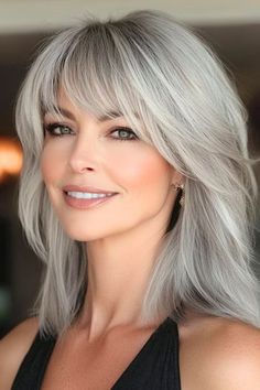 Save this pin for the best haircuts for older women with fine hair. This shaggy shoulder-length cut is giving serious rock star vibes. The layers create depth and texture, making your hair appear thicker and more voluminous than it really is. Medium Length Haircuts For Gray Hair, Over The Shoulder Haircut With Layers, Low Matienence Haircut Long Hair, Silver Hair Styles Over 50, All Pins Saved, Mid Length Gray Hair, Shag Hairstyles For Fine Hair Over 50, Medium Length Grey Hair With Bangs, Hairstyles For Women Over 50 Fine Hair