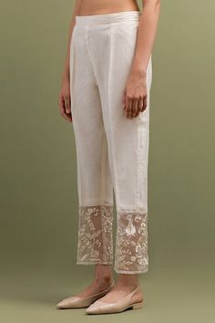 Ivory kurta with thread embroidery and organza patch on the hem, sleeves and back. Paired with patchwork embroidered hem pant. - Aza Fashions Chikankari Embroidery Straight Pants For Wedding, Wedding Straight Pants With Chikankari Embroidery, Elegant White Chikankari Embroidery Bottoms, Elegant White Chikankari Embroidered Bottoms, Elegant White Bottoms With Chikankari Embroidery, Elegant White Bottoms With Lace Work, White Festive Bottoms For Wedding, Festive White Bottoms For Wedding, Fitted White Pants With Chikankari Embroidery