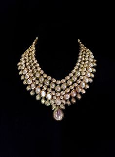 Luxurious Kundan bridal necklace that consists of clear Kundan gems. Handcrafted with great care and excellent precision. This minimalistic bridal set is sure to make you feel like a million bucks. It is a jewelry set sure to make you stand out from the crowd. It is the perfect piece of jewelry for any bridal occasion. INCLUDES: Necklace *Earrings and Tikka can be added for this set. Details: Handcrafted Metal: Gold Plated, Metal Alloy Stone: Kundan Stones DELIVERY: * The necklace can be customi Temple Jewelry Kundan Bridal Necklace With Rose Cut Diamonds, Temple Style Kundan Chandbali Necklace With Rose Cut Diamonds, Temple Style Kundan Necklace With Chandbali Rose Cut Diamonds, Traditional Kundan Bridal Necklace With Rose Cut Diamonds, Kundan Necklace With Rose Cut Diamonds For Celebration, Bollywood Style Kundan Necklace With Rose Cut Diamonds, Kundan Necklaces With Rose Cut Diamonds For Reception, Bollywood Bridal Kundan Necklace With Rose Cut Diamonds, Bollywood Style Bridal Necklace With Rose Cut Kundan Diamonds