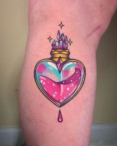 a heart shaped tattoo with a crown on it