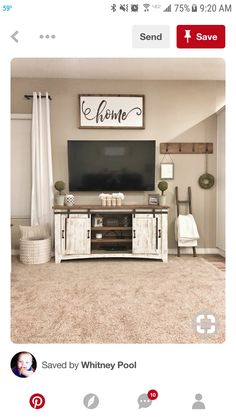 a tv sitting on top of a wooden stand in a living room