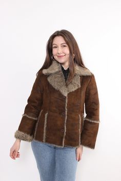 Hi! This is vintage from 90s brown sherpa jacket with button up closure. This retro style penny lane coat made of  POLYESTER. The model in the photo is 170 cm tall and is wearing a LARGE size grunge jacket. ( L - sizes on the tag). But, be careful, this is a vintage size, it is better to check the measurements below in the product description. Sleeve - 40cm / 15.74inch; Width - 48cm / 18.89inch; Length - 60cm / 23.62inch. All measurements are taken seam to seam while lying flat. Sleeve measureme Brown Fur Coat With Buttons For Fall, Brown Fur Coat With Button Closure For Fall, Brown Winter Fur Coat With Button Closure, Retro Long Sleeve Winter Fur Coat, Retro Long Sleeve Fur Coat For Winter, Vintage Outerwear With Faux Fur Lining And Long Sleeves, Vintage Brown Long Sleeve Outerwear For Winter, Retro Brown Outerwear With Button Closure, Retro Brown Outerwear With Faux Fur Trim