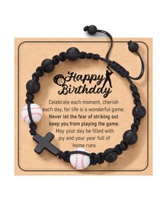 a black bracelet with baseballs and a cross on it that says happy birthday, celebrate each moment, cherish each other