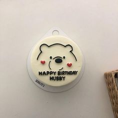 a happy birthday badge with a bear on it