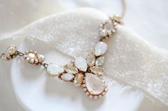 Glamorous as can be, this vintage inspired bridal necklace is handcrafted with layers of Swarovski crystals to guarantee that you shine on your big day! - Handcrafted with CRYSTALLIZED™ - Swarovski Elements - Each stone is set by hand in my studio - Swarovski golden shadow, ivory cream, white opal and clear stones - Antique gold finish pictured - Available in rose gold, antique gold and rhodium (silver) finishes - Necklace pictured measures 16 inches and extends to 18 inches - Pendant measures 3 Elegant Jeweled Necklaces For Weddings, Crystal Jeweled Necklace For Wedding, Wedding Costume Jewelry Necklaces With Sparkling Stones, Costume Jewelry Pendant Necklace For Wedding, White Jeweled Bridal Necklace For Wedding, Wedding Costume Jewelry Necklace With Jewels, Rose Gold Choker Necklace, Crystal Wedding Necklace, Gold Bridal Necklace