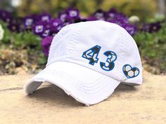 Need to change this cap design to a messy bun/high ponytail cap style, a non-distressed baseball cap or kid's baseball cap?  Once you have this cap in your cart, head here: https://etsy.me/2S82fka Distinct Headwear Presents... Women's Soccer Embroidered Cap with Custom Number and Colors -Every hat is made from scratch and the number and/or heart are directly embroidered on the cap base. -No cheaply done, glued on patches, vinyl stickers fabric pieces  At checkout, please include the 1 or 2-digit White Team Spirit Baseball Cap For Sports, White Sports Fan Baseball Cap For Sports Events, White Baseball Cap With Letter Print For Sports Fans, White Letter Print Baseball Cap For Sports Fans, White Pre-shrunk Baseball Cap For Sports Events, White Letter Print Baseball Cap For Fans, Personalized White Trucker Hat For Sports Events, Personalized White Baseball Cap For Baseball Season, Personalized White Baseball Cap For Sports Events