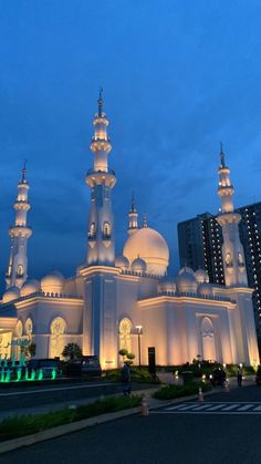 a large white building lit up at night